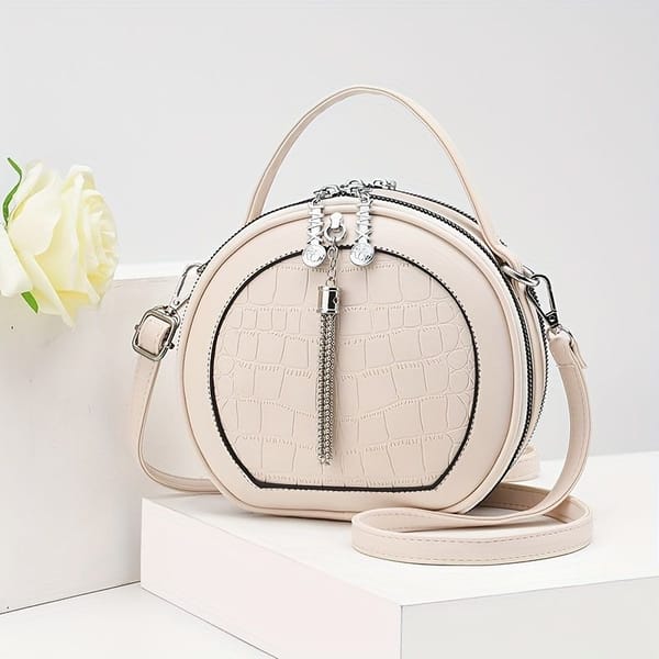 Round Croc-Embossed Handbag with Tassel – Beige